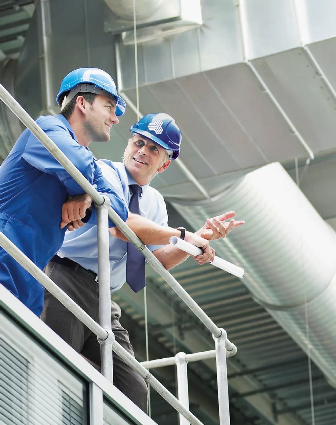 Service engineers inspecting a compressor room