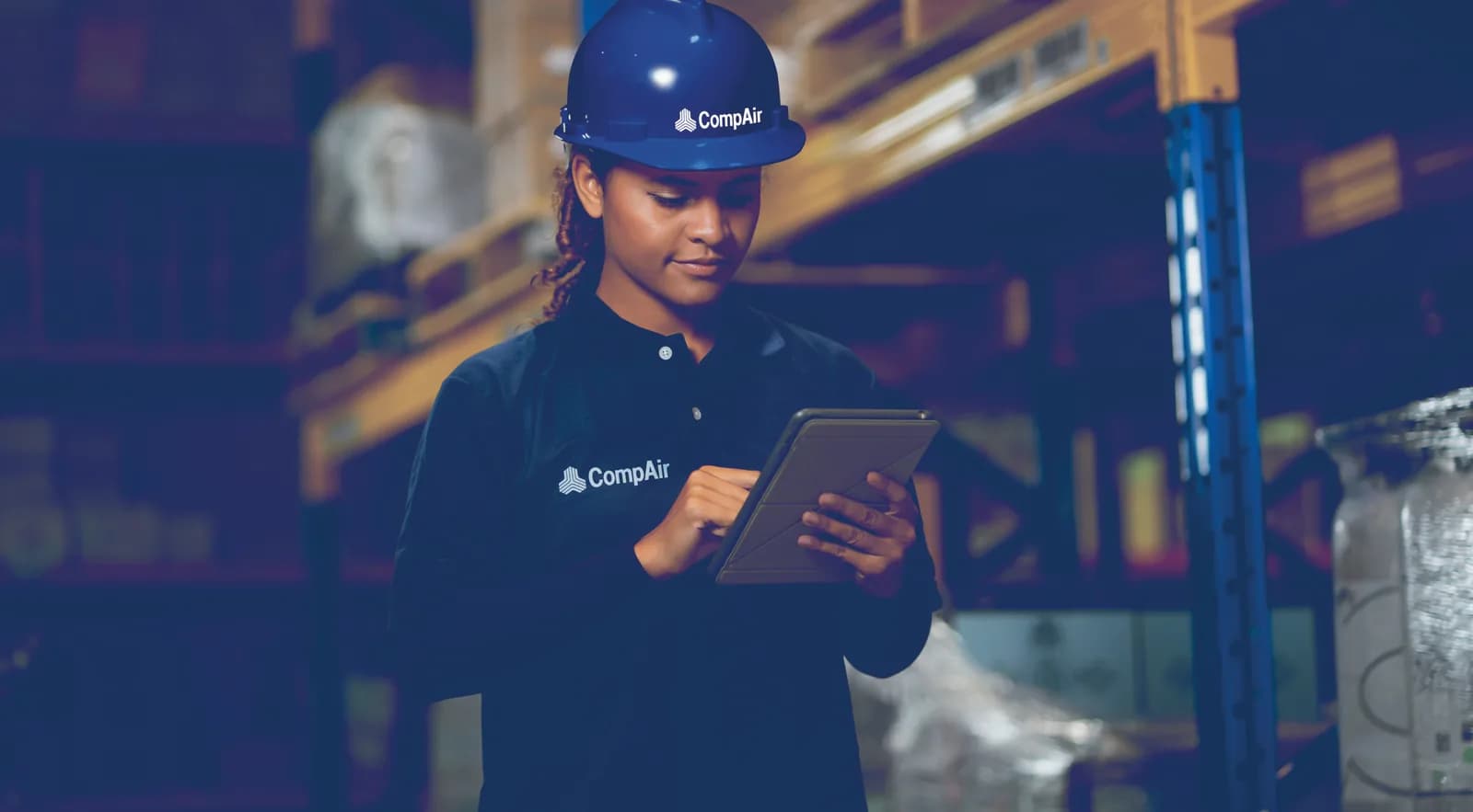 Service engineer reviewing service data on a tablet
